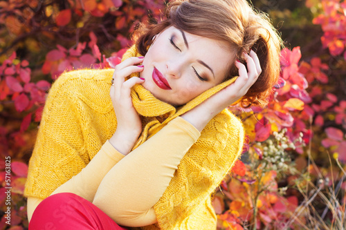Photo: Pretty woman in autumn park Pretty woman in autumn park
