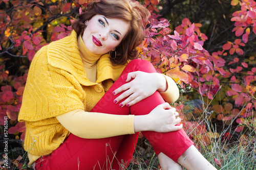Photo: Pretty woman in autumn park Pretty woman in autumn park