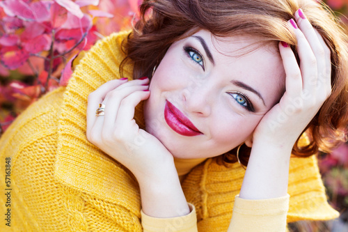 Photo: Pretty woman in autumn park Pretty woman in autumn park
