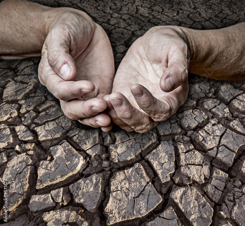 Photo: old elderly hands and dry earth old elderly hands and dry earth