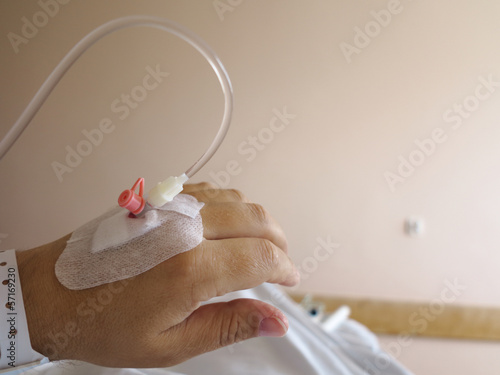 Photo: Patient's hand in the hospital with an IV Patient's hand in the hospital with an IV