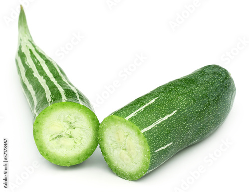 Photo: Sliced Snake gourd over white background Sliced Snake gourd over white background