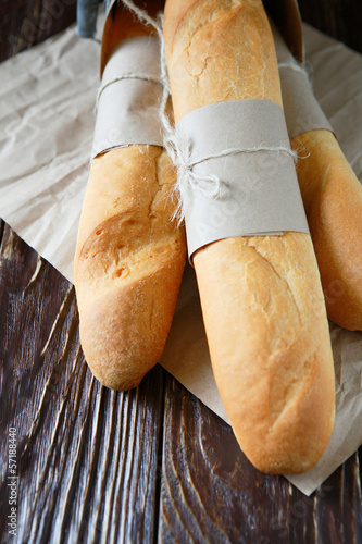 Photo: fresh baguettes tied with kraft paper fresh baguettes tied with kraft paper