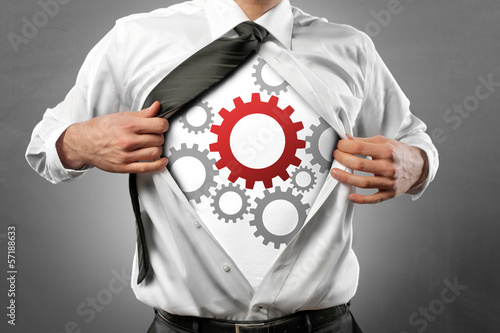 Photo: Man with cogwheels Man with cogwheels