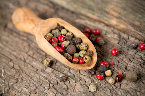 Photo: color pepercorns in a wooden scoop color pepercorns in a wooden scoop