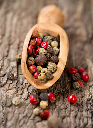 Photo: color pepercorns in a wooden scoop color pepercorns in a wooden scoop
