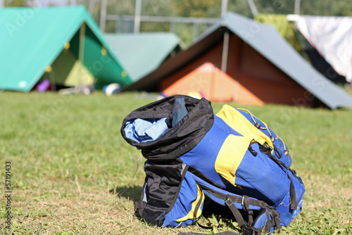 Photo: backpack amid the tents of camp during the adventurous excursion backpack amid the tents of camp during the adventurous excursion