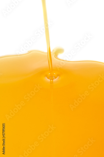 Photo: Pouring Honey on White Background Pouring Honey on White Background