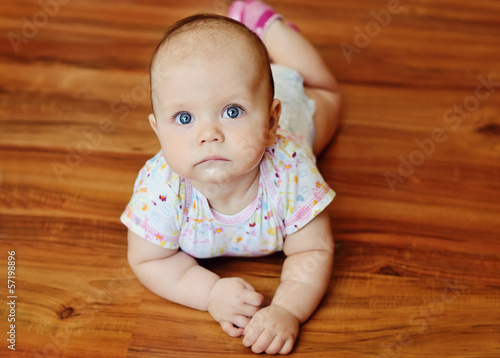 Photo: baby laying on the floor baby laying on the floor