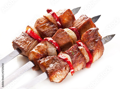 Photo: Grilled kebab (shashlik) on spits. Grilled kebab (shashlik) on spits.