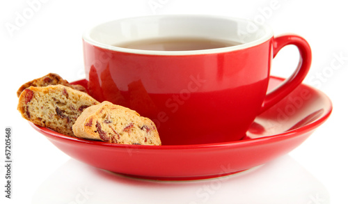 Photo: Cup of tea with cookies isolated on white Cup of tea with cookies isolated on white