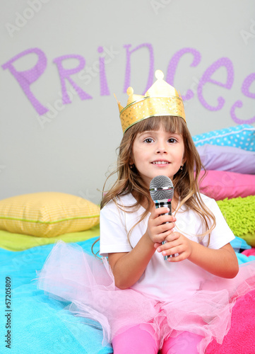 Photo: Little girl sitting Little girl sitting