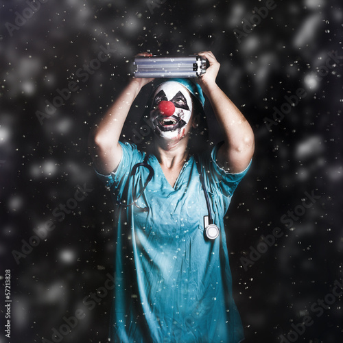 Photo: Crazy doctor clown laughing in rain Crazy doctor clown laughing in rain