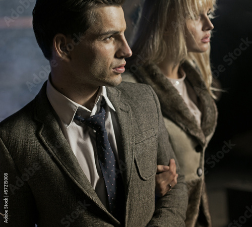 Photo: Serious man holding his lady Serious man holding his lady