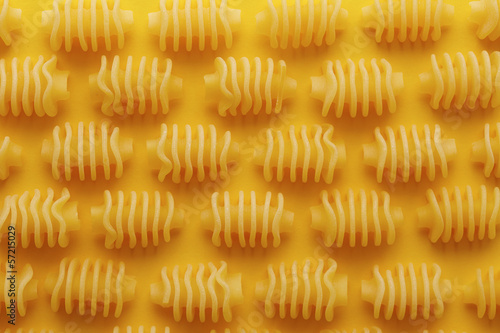 Photo: Raw radiatori pasta texture Raw radiatori pasta texture