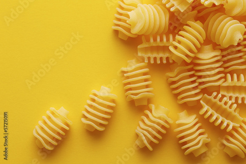 Photo: Raw radiatori pasta texture Raw radiatori pasta texture