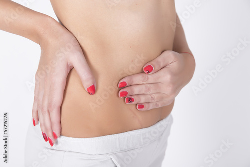Photo: Stomach pain. Woman having abdominal pain, upset stomach or mens Stomach pain. Woman having abdominal pain, upset stomach or mens