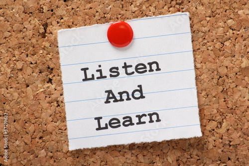 Photo: Listen and Learn paper note on a cork notice board Listen and Learn paper note on a cork notice board