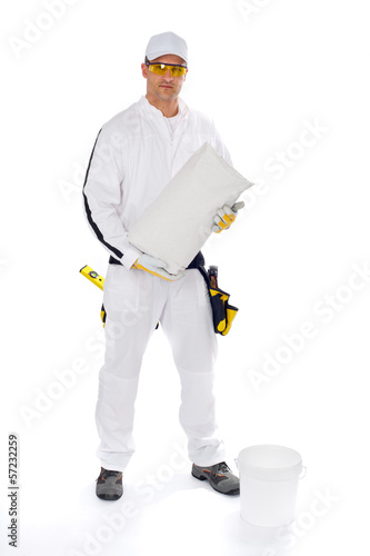 Photo: worker in white overalls holding a bucket trowel tools package worker in white overalls holding a bucket trowel tools package