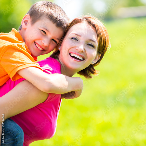 Photo: Happy mother and son outdoor portrait Happy mother and son outdoor portrait