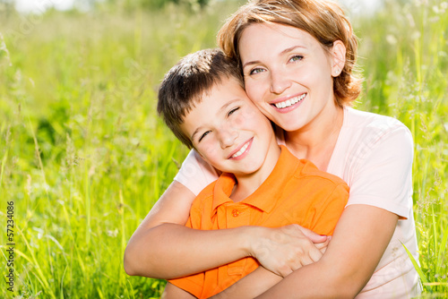 Photo: Happy mother and son outdoor portrait Happy mother and son outdoor portrait