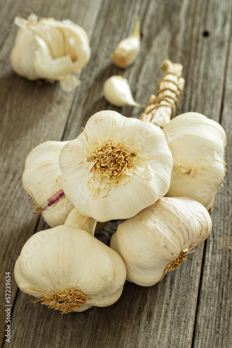Photo: Garlic heads on a wooden table Garlic heads on a wooden table