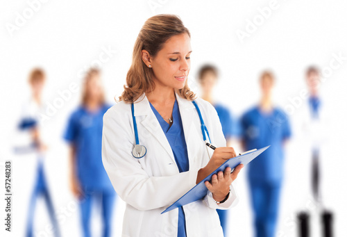 Photo: Doctor writing on a clipboard Doctor writing on a clipboard