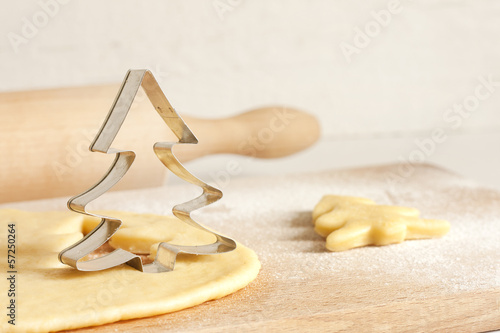 Photo: Christmas baking food concept with tree and dough Christmas baking food concept with tree and dough