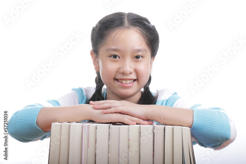 Photo: Student girl holding books Student girl holding books