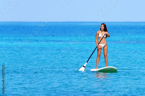 Photo: Stand up paddle board woman paddleboarding Stand up paddle board woman paddleboarding