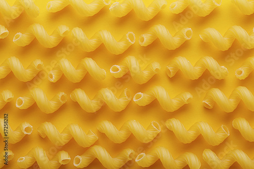 Photo: Raw cavatappi pasta texture Raw cavatappi pasta texture