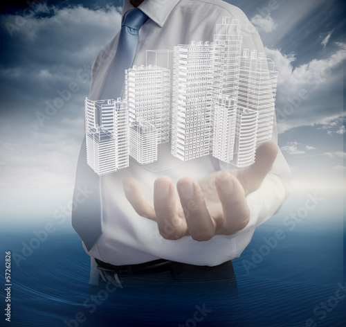Photo: Close up of hand showing faint holographic city Close up of hand showing faint holographic city