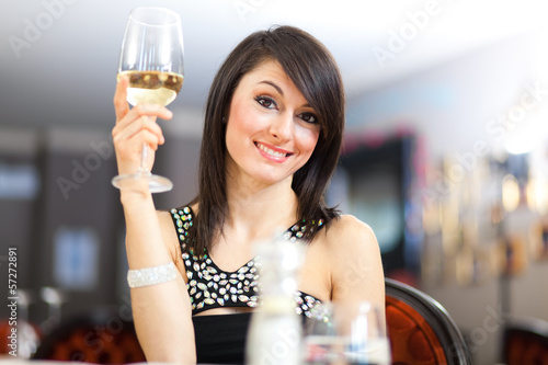 Photo: Beautiful woman holding a glass of wine Beautiful woman holding a glass of wine