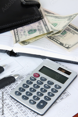Photo: Office supplies with wallet and documents close up Office supplies with wallet and documents close up