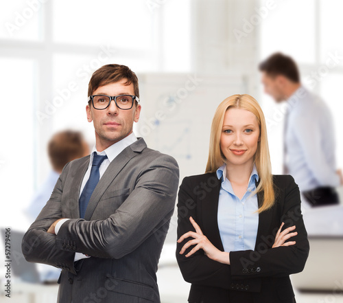 Photo: businessman and businesswoman in the front of team businessman and businesswoman in the front of team