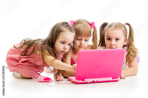 Photo: group of kids friends looking at the laptop group of kids friends looking at the laptop