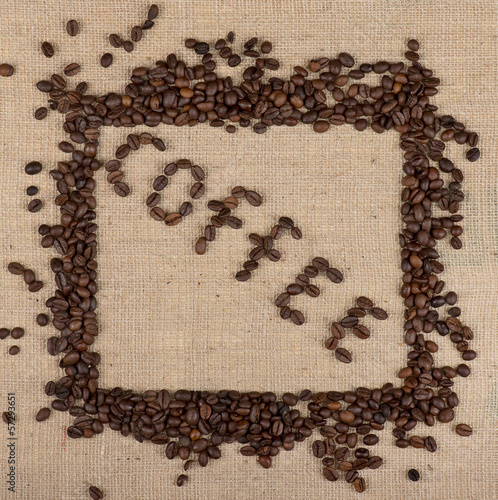 Photo: "Coffee" word made of coffee beans with a frame of beans "Coffee" word made of coffee beans with a frame of beans