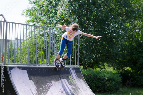Photo: Young teenage girl roller blading Young teenage girl roller blading