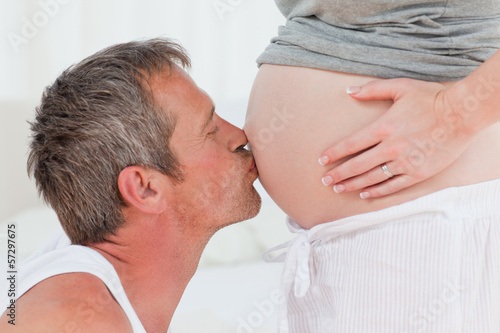 Photo: Man kissing his wife Man kissing his wife