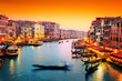 Venice, Italy. Gondola floats on Grand Canal at sunset Venice, Italy. Gondola floats on Grand Canal at sunset