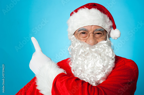 Photo: Santa claus pointing away Santa claus pointing away