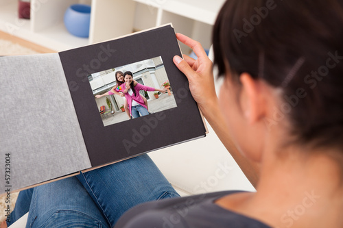 Photo: Woman With Photo Album Woman With Photo Album