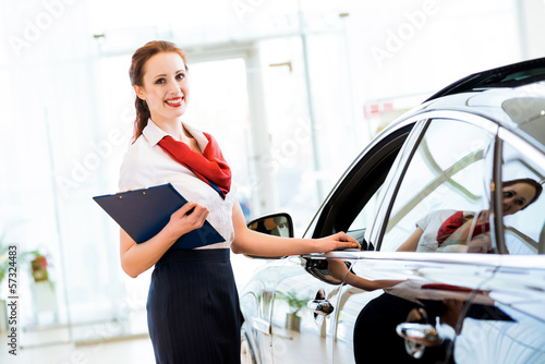 Photo: young woman in a showroom consultant young woman in a showroom consultant