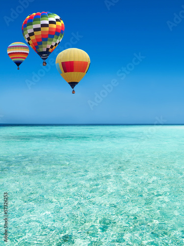 Photo: Hot air balloons travel over the sea Hot air balloons travel over the sea