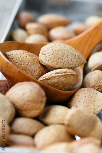 Photo: Spoon of fresh whole almonds Spoon of fresh whole almonds