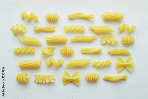 Photo: Different types of pasta on white background Different types of pasta on white background