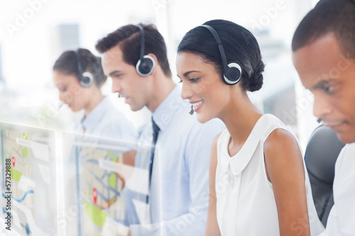 Photo: Call center employees at work on futuristic hologram interfaces Call center employees at work on futuristic hologram interfaces