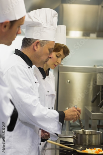 Photo: Head chef inspecting his students pot Head chef inspecting his students pot