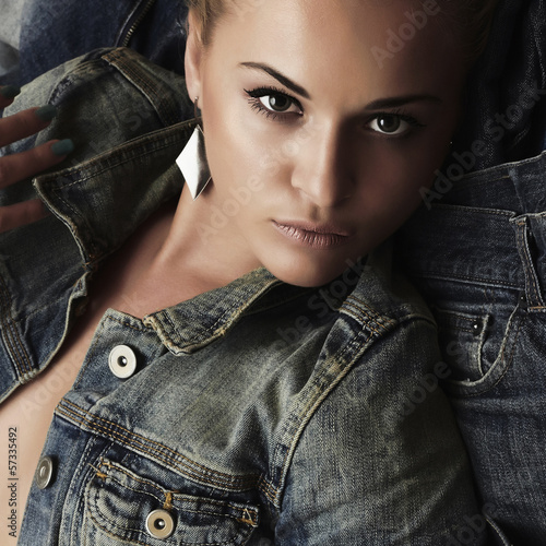 Photo: Fashion beautiful girl. denim jeans wear. beauty woman Fashion beautiful girl. denim jeans wear. beauty woman
