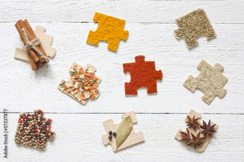 Photo: Food ingredients spices and puzzle diet background concept Food ingredients spices and puzzle diet background concept